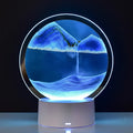 Lampe sablier avec particules colorées en suspension lumineuse, objet contemplatif relaxant